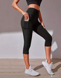 L183 Legging negro capri con bolsa para cel